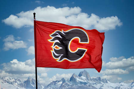 Calgary, Alberta, Canada. May 5, 2022. A Calgary flames flag with a blue sky