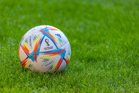 Al Khor, Qatar. Jul 5, 2022. An Adidas Al Rihla Football on a football soccer field with green grass. Concept: 2022 FIFA World Cup Qatarのeditorial素材
