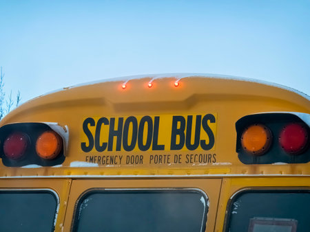 Calgary, Alberta, Canada. Dec 21, 2022 A a close up to a yellow school bus.のeditorial素材