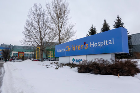 Calgary, Alberta, Canada. Dec 27, 2022. A close up the Alberta Children's Hospital entrance sign during the winter.のeditorial素材