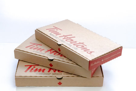 Calgary, Alberta, Canada. Feb 26, 2023. A few Tim Horton's pizza boxes on a white box.のeditorial素材
