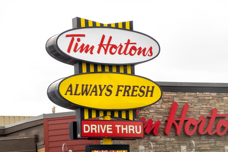 Calgary, Alberta, Canada. Apr 04, 2023. A Tim Hortons, always fresh and drive thru sign.のeditorial素材
