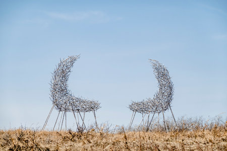 Calgary, Alberta, Canada. Apr 15, 2023. A couple of art structors call The Convergence, stainless steel, acrylic prisms City of Calgary Art.のeditorial素材