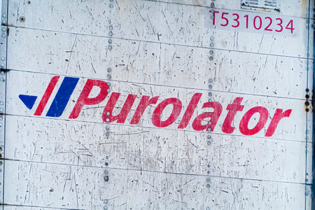 Calgary, Alberta, Canada. Apr 24, 2023. A close up to a Purolator logo to a delivery truck.