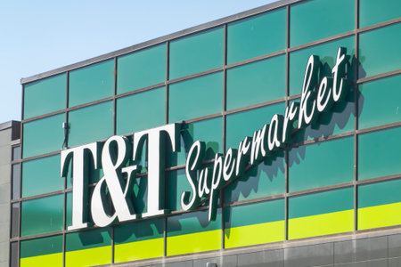 Calgary, Alberta, Canada. Apr 30, 2023. A side view of a T and T Supermarket store sign.のeditorial素材