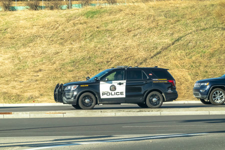 Calgary, Alberta. Canada. May 3, 2023. A SUV Car Police patrol on the route during early spring.のeditorial素材