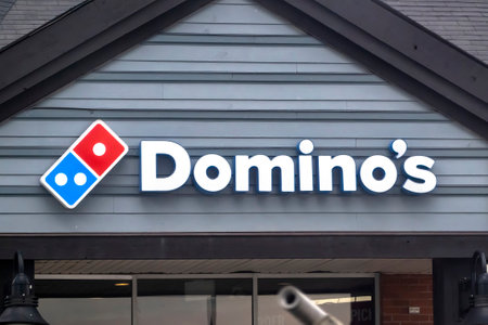 Calgary, Alberta, Canada. May 9, 2023. A Dominoâs Pizza restaurant entrance.のeditorial素材