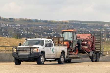 Calgary, Alberta, Canada. May 9, 2023. A Pickup truck carrying a couple of heavy duty mowers during...