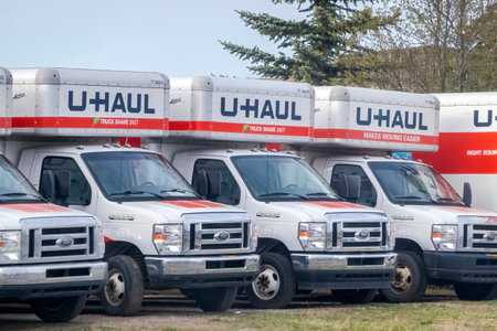 Calgary, Alberta, Canada. May 11, 2023. U-Haul trucks parked during the spring.のeditorial素材