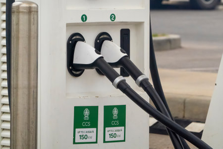 Calgary, Alberta, Canada. May 17, 2023. A close up to an electric station vehicle charging plug.のeditorial素材