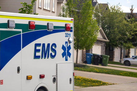 Calgary, Alberta, Canada. May 22, 2023. A close up to an EMS logo ambulance.のeditorial素材