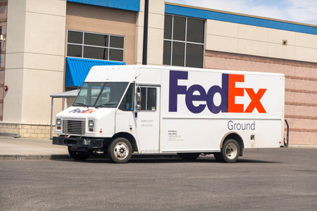Calgary, Alberta, Canada. Jun 6, 2023. A Fedex delivery truck parked in front of a Walmart store.