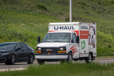 Calgary, Alberta, Canada. Jun 6, 2023. An U-Haul moving small rent truck on the route.のeditorial素材