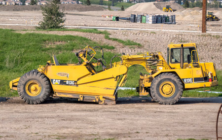 Calgary, Alberta, Canada. July 30, 2023. A CAT 613C series 2 elevating paddle wheel scraper.のeditorial素材