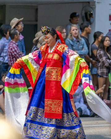 Performer in traditional costume performing at the annual Malacca Carnival.のeditorial素材
