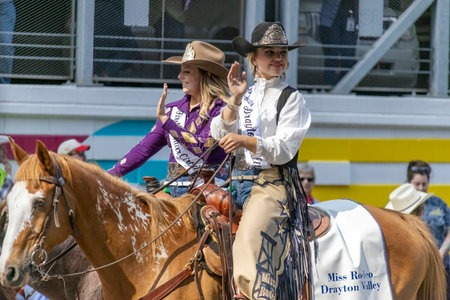Calgary, Alberta, Canada. July 10, 2023. Miss Rodeo Queen of Drayton Valley at a public parade riding a horse.のeditorial素材