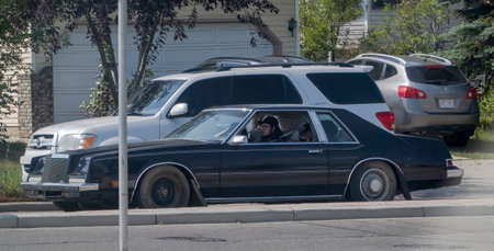 Calgary, Alberta, Canada. Aug 7,2023. A vintage black Chrysler Cordoba. A full-sized luxury car based on the Chrysler Newport that was marketed during the 1970 model year.のeditorial素材