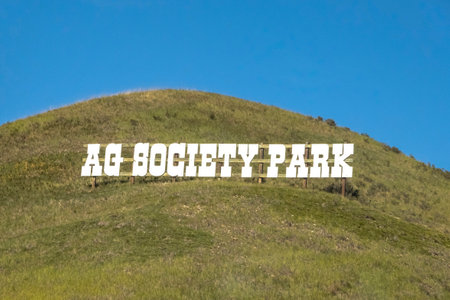 Cochrane, AB, Canada. Aug 13 ,2023. Agricultural Society Park sign on a hill. An organization in Cochrane, Albertaのeditorial素材