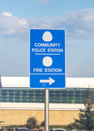 Calgary, Alberta, Canada. Sep `10, 2023. A Community Police Station and Fire Station street sign. Concept: Emergency Public services.のeditorial素材