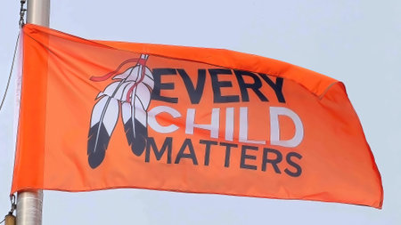 Calgary , Alberta, Canada. Oct 1, 2023. An orange flag with the text Every Child Matters during the National Day for Truth and Reconciliation. Concept: Orange Shirt Day.のeditorial素材