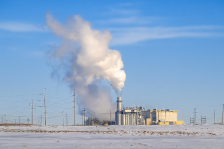 Calgary, Alberta, Canada. Feb 19, 2024. The Calgary Energy Centre a combined cycle power electricity plant. Concept: Steam coming out of power station chimney power generationのeditorial素材
