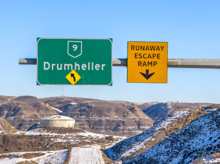 Drumheller, Alberta, Canada. Feb 21, 2024. A road sign to the Drumheller town.のeditorial素材