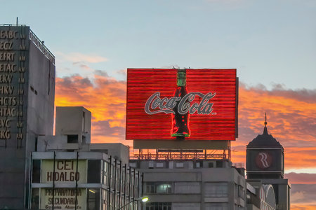 Mexico City, Mexico. Jan 14, 2024. A Coca Cola advertisement sign during a sunset.のeditorial素材