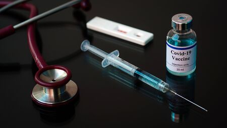 Vaccines Stethoscope rapid test and syringes ,Vaccine vial dose flu shot drug needle syringe, medical,concept vaccination hypodermic injection treatment disease care hospital prevention immunization .の写真素材