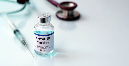 Vaccines Stethoscope and syringes ,Vaccine vial dose flu shot drug needle syringe, medical,concept vaccination hypodermic injection treatment disease care hospital prevention immunization .の写真素材