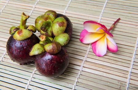 mangosteen Thai fruit delicious sweet  on a wooden backgroundの写真素材