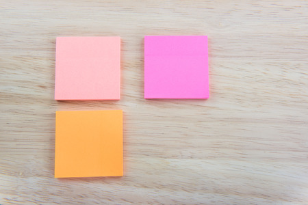 Color  Paper notes with sticky note on Wood Backgroundの写真素材