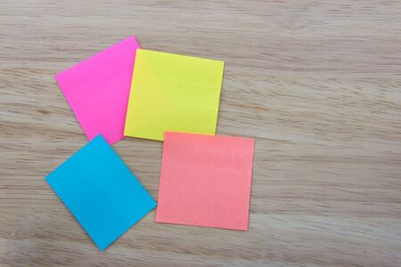 Color  Paper notes with sticky note on Wood Backgroundの写真素材
