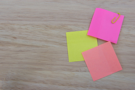 Color  Paper notes with sticky note on Wood Backgroundの写真素材