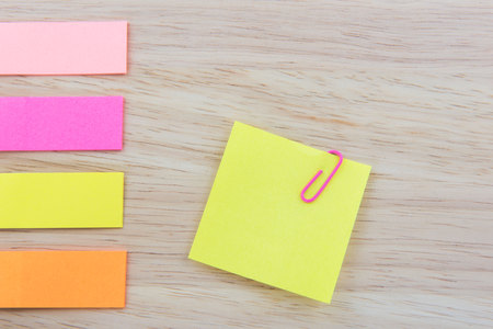 Color  Paper notes with sticky note on Wood Backgroundの写真素材