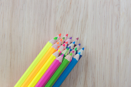 Colors pencils, colorful many crayons on wood backgroundの写真素材