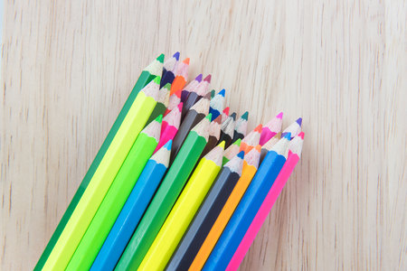 Colors pencils, colorful many crayons on wood backgroundの写真素材