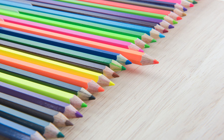 Colors pencils, colorful many crayons on wood backgroundの写真素材