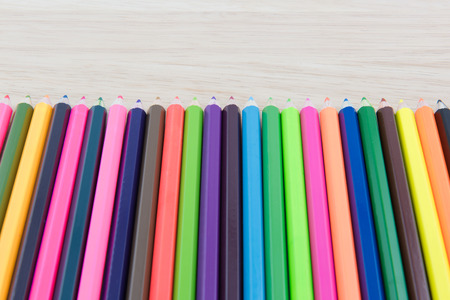 Colors pencils, colorful many crayons on wood backgroundの写真素材