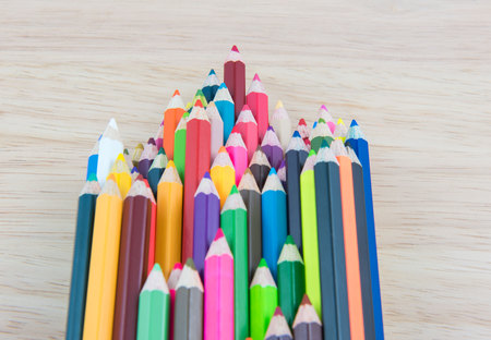Colors pencils, colorful many crayons on wood backgroundの写真素材