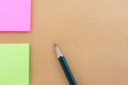 Color  Paper notes with sticky note on brown Backgroundの写真素材