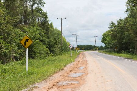 Country Road, Beware of the curve, Slow downの写真素材