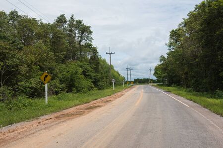 Country Road, Beware of the curve, Slow downの写真素材