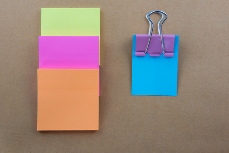 Color  Paper notes with sticky note on brown Backgroundの写真素材