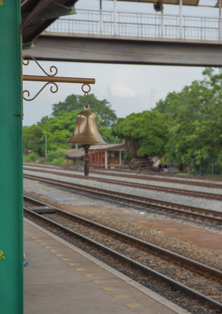 Gold bell on the train station in Thailand.の写真素材