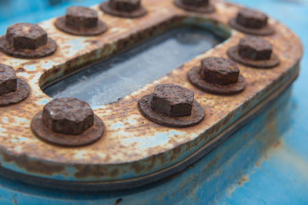 closeup Big rusty metal Screws and nuts locked with rust