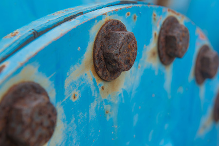 closeup Big rusty metal Screws and nuts locked with rustの写真素材