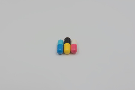 Colorful capsule drug on white backgroundの写真素材