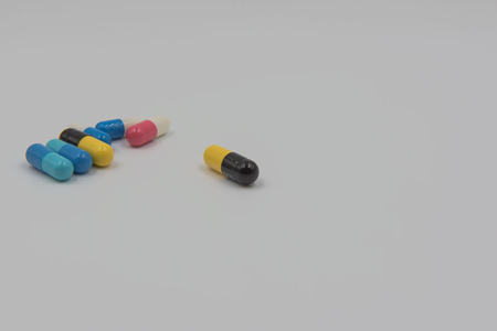 Colorful capsule drug on white backgroundの写真素材