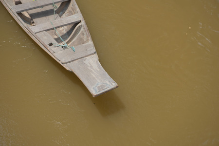 Old wooden boat on a river for background