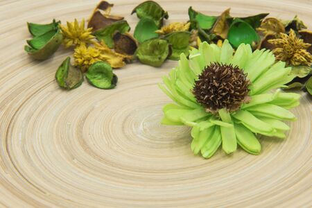 Green aromatic dried herbs aromatic flowers on wooden background.の写真素材